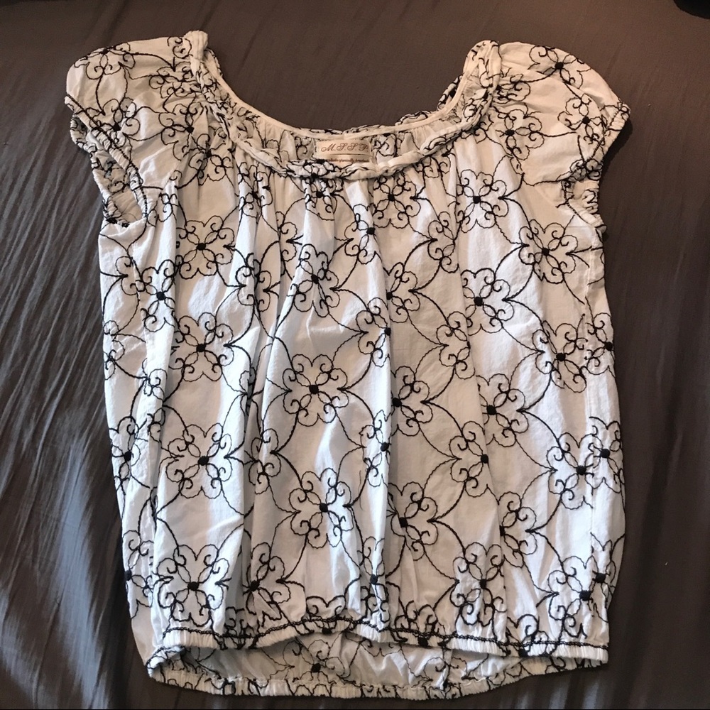 White and black floral blouse